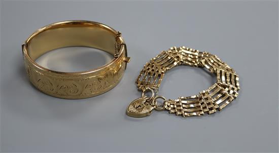 A 9ct gold gatelink bracelet with padlock clasp and a 1/5th - 9ct gold engraved bangle,